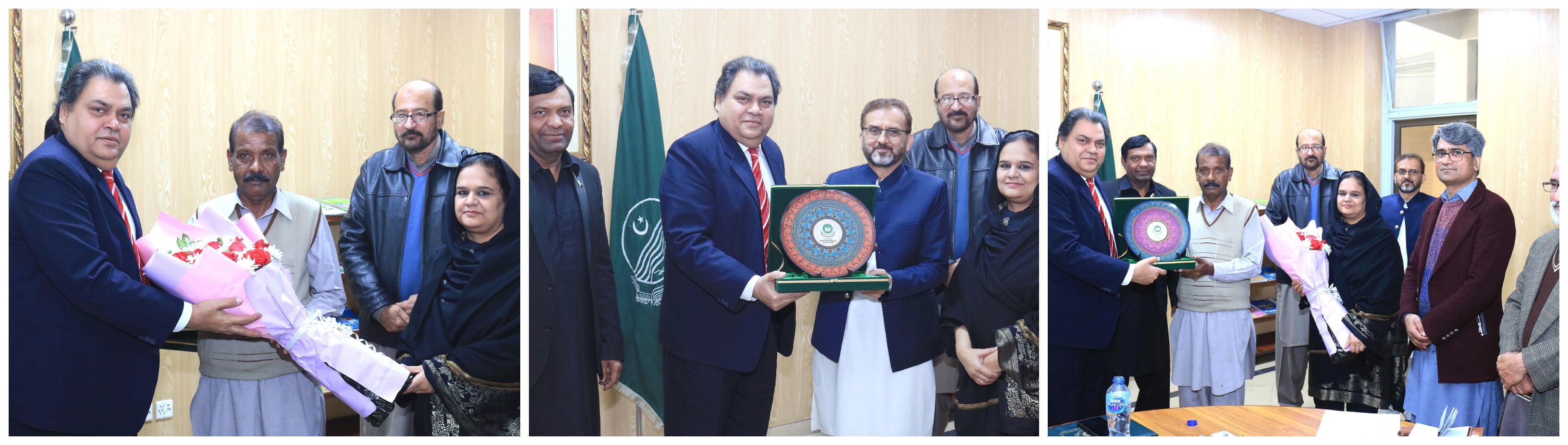 DG QAED presented shield and flowers
